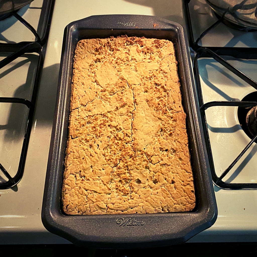 millet flour sourdough bread in container baked